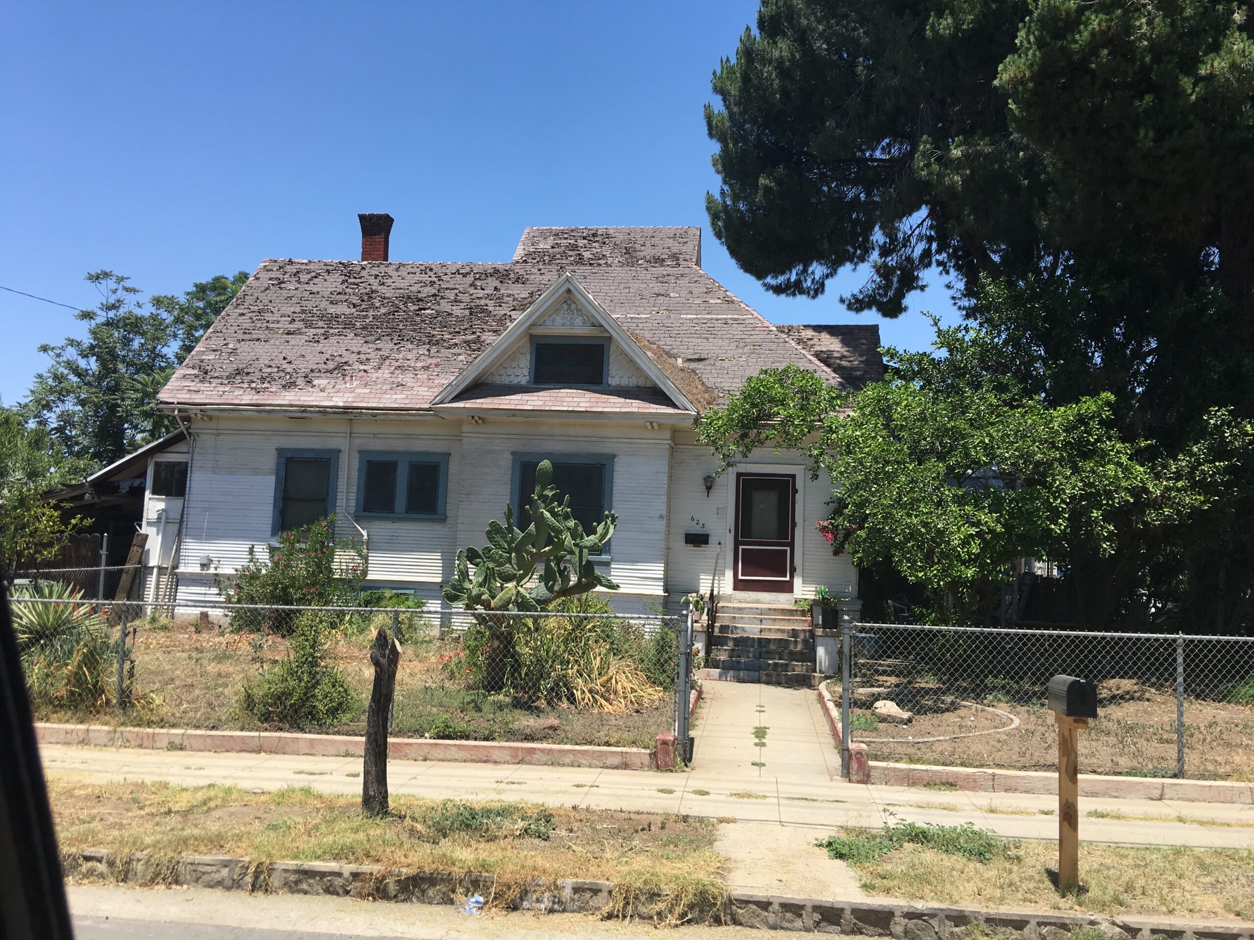 Photo showing heavy aged Shingle Roofing